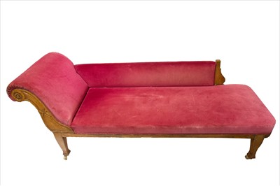 Lot 3279 - A late 19th century oak chaise longue.