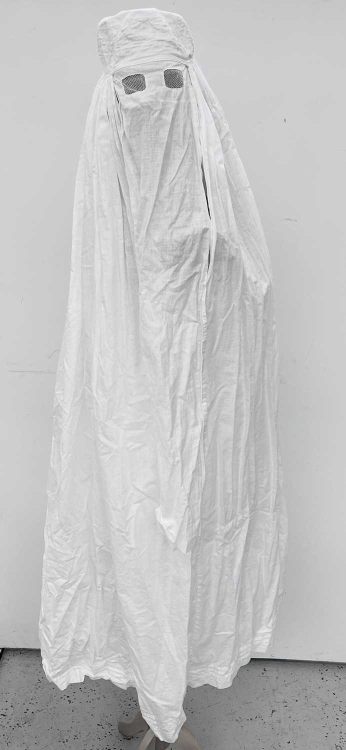 Lot 1065 - An Islamic white cotton burkha, early 20th