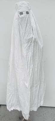 Lot 1065 - An Islamic white cotton burkha, early 20th...