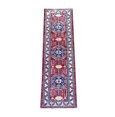 Lot 1250 - A Chobi type runner, the madder field with...