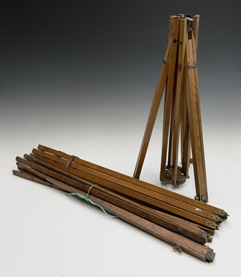 Lot 135 - An ash and brass folding tripod, early 20th...