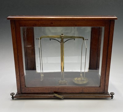 Lot 143 - A brass precision laboratory balance, by W & T...