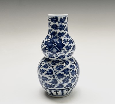 Lot 11 - A Chinese porcelain blue and white double...