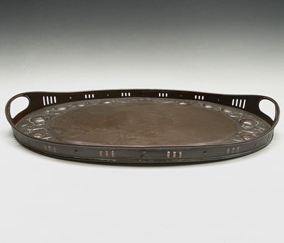 Lot 3 - A Newlyn copper oval tray, circa 1910, the...