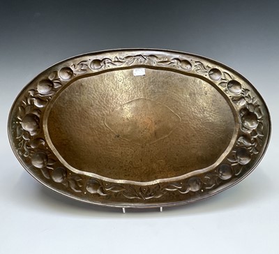 Lot 3 - A Newlyn copper oval tray, circa 1910, the...