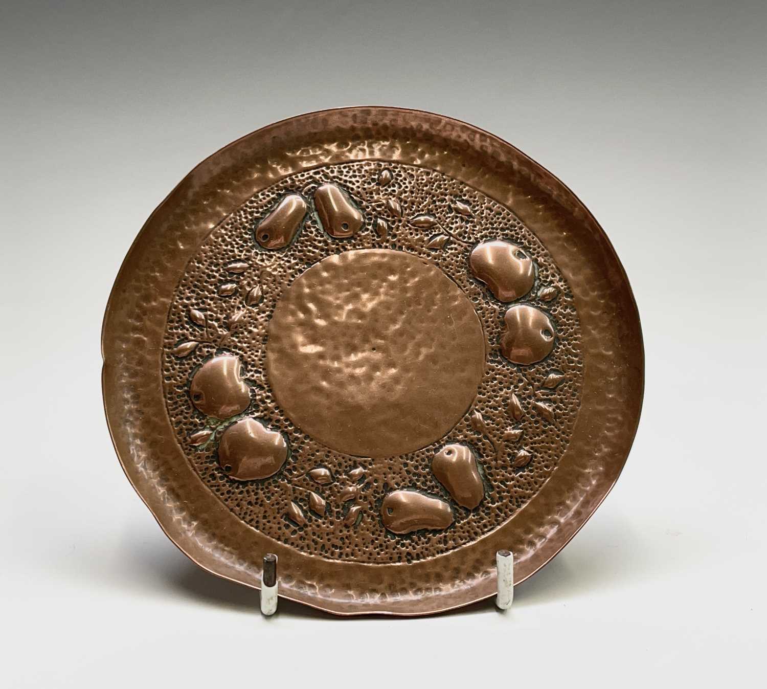 Lot 4 - A Newlyn copper small circular dish, repousse...