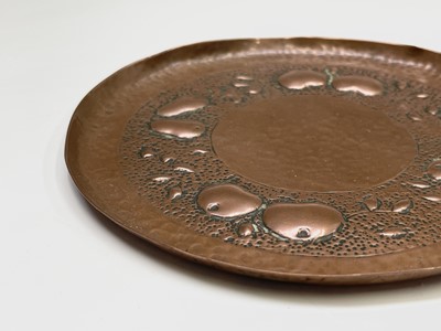 Lot 4 - A Newlyn copper small circular dish, repousse...
