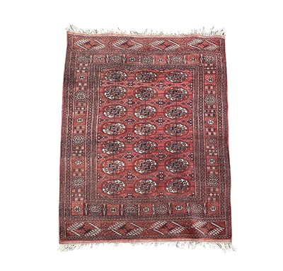 Lot 1266 - A Pakistan rug, the madder field with seven...