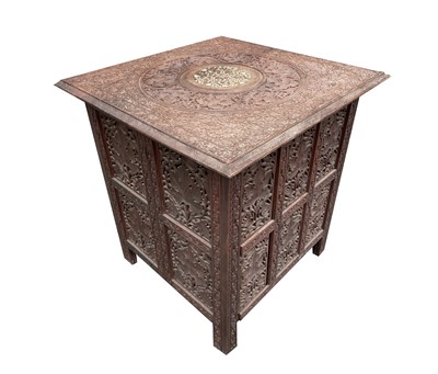 Lot 1002 - An Indian carved wood ocassional table, circa...