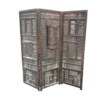 Lot 1003 - A Syrian carved wood folding screen, 19th...