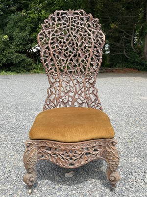 Lot 1004 - An Anglo-Indian carved teak chair, 19th...