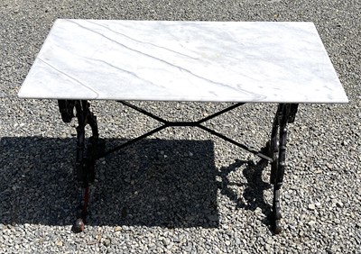 Lot 613 - A black painted cast iron garden table with...