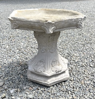 Lot 615 - A composition stone birdbath, the hexagonal...