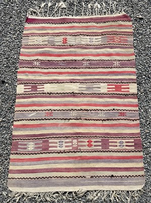 Lot 1270 - A Persian kelim rug, with multiple horizontal...