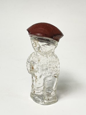 Lot 167 - A 1920s perfume bottle, moulded as a small boy,...