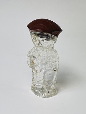 Lot 167 - A 1920s perfume bottle, moulded as a small boy,...
