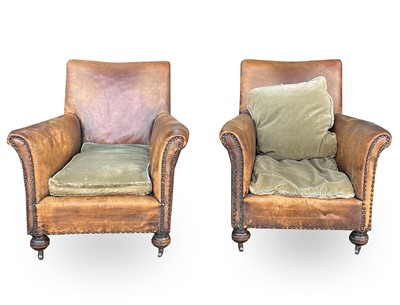 Lot 3040 - A pair of leather-upholstered club-type...