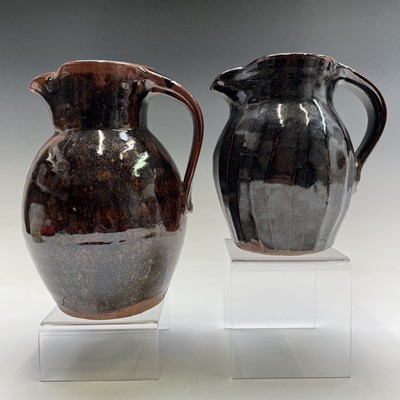 Lot 1032 - Two Trevor Corser brown glazed jugs, impressed...