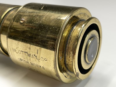 Lot 115 - A Naval brass day and night telescope gunsight,...