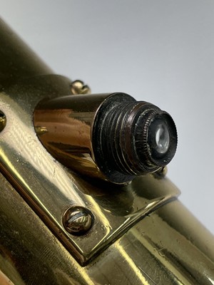 Lot 115 - A Naval brass day and night telescope gunsight,...