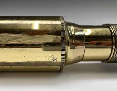 Lot 115 - A Naval brass day and night telescope gunsight,...