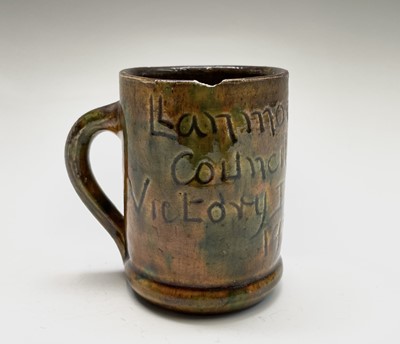 Lot 843 - A Ewenny pottery small mug, commemorating...