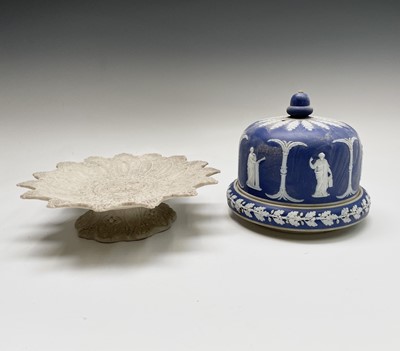Lot 839 - A Jasperware cheese dome and stand, decorated...