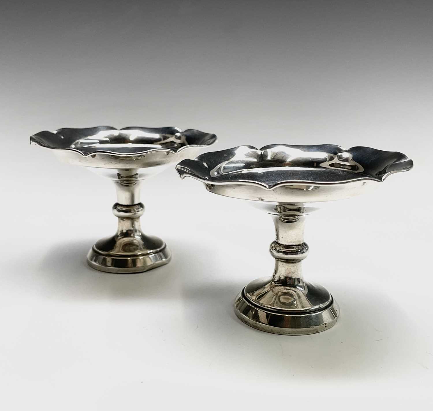 Lot 33 - A pair of filled silver bonbon stands...