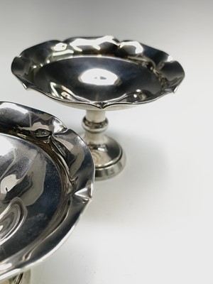 Lot 33 - A pair of filled silver bonbon stands...