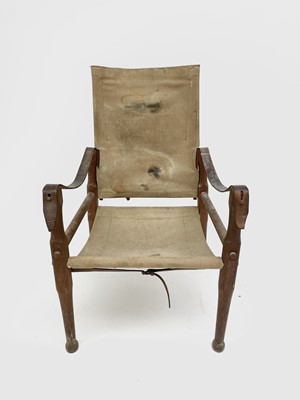 Lot 3194 - A WWI beech, leather and canvas campaign chair,...