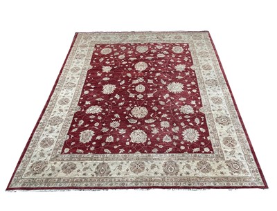 Lot 1281 - A Ziegler design Chobi carpet, the madder...