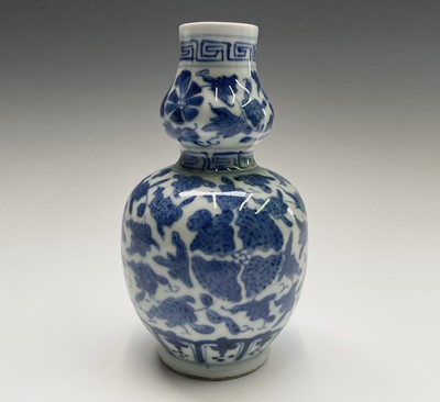 Lot 78 - A pair of Chinese double gourd porcelain vases,...