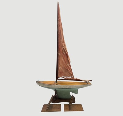 Lot 260 - A painted wooden pond yacht, with simulated...