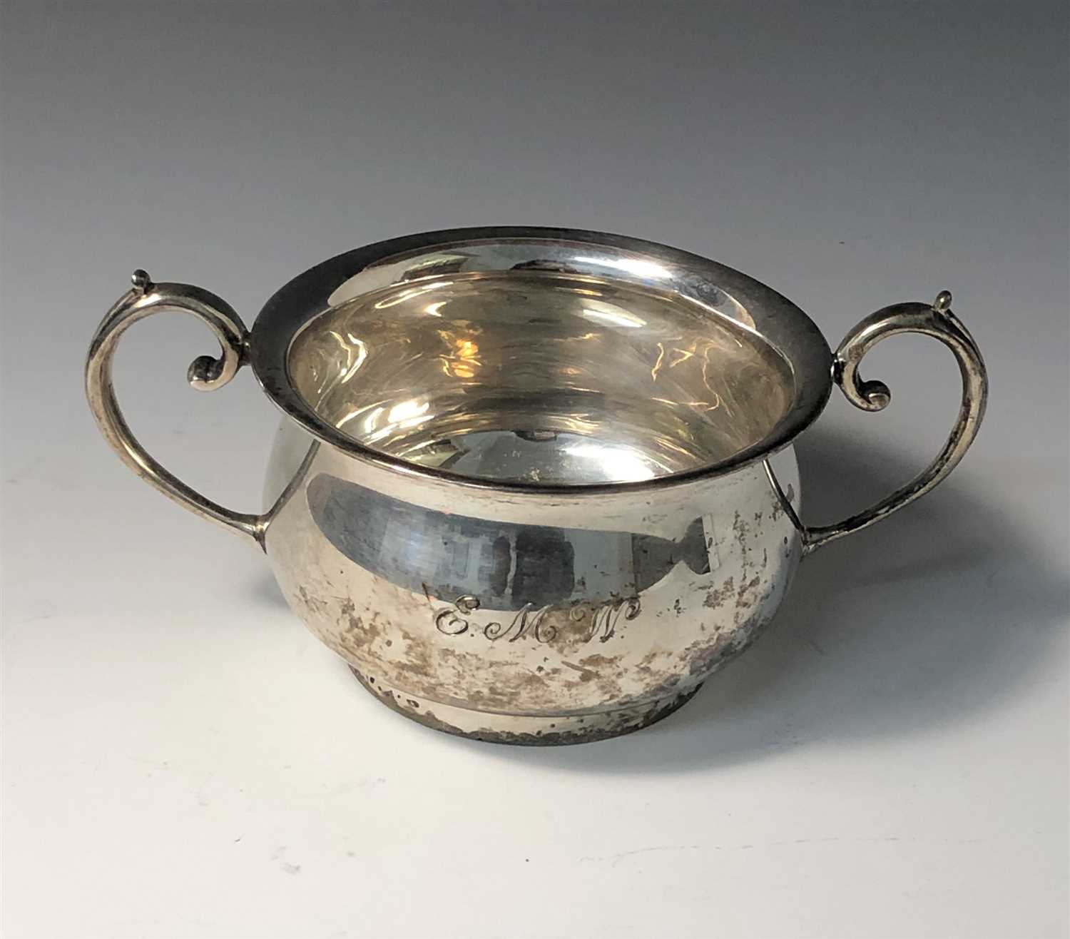 Lot 2019 - A bellied silver twin handled bowl