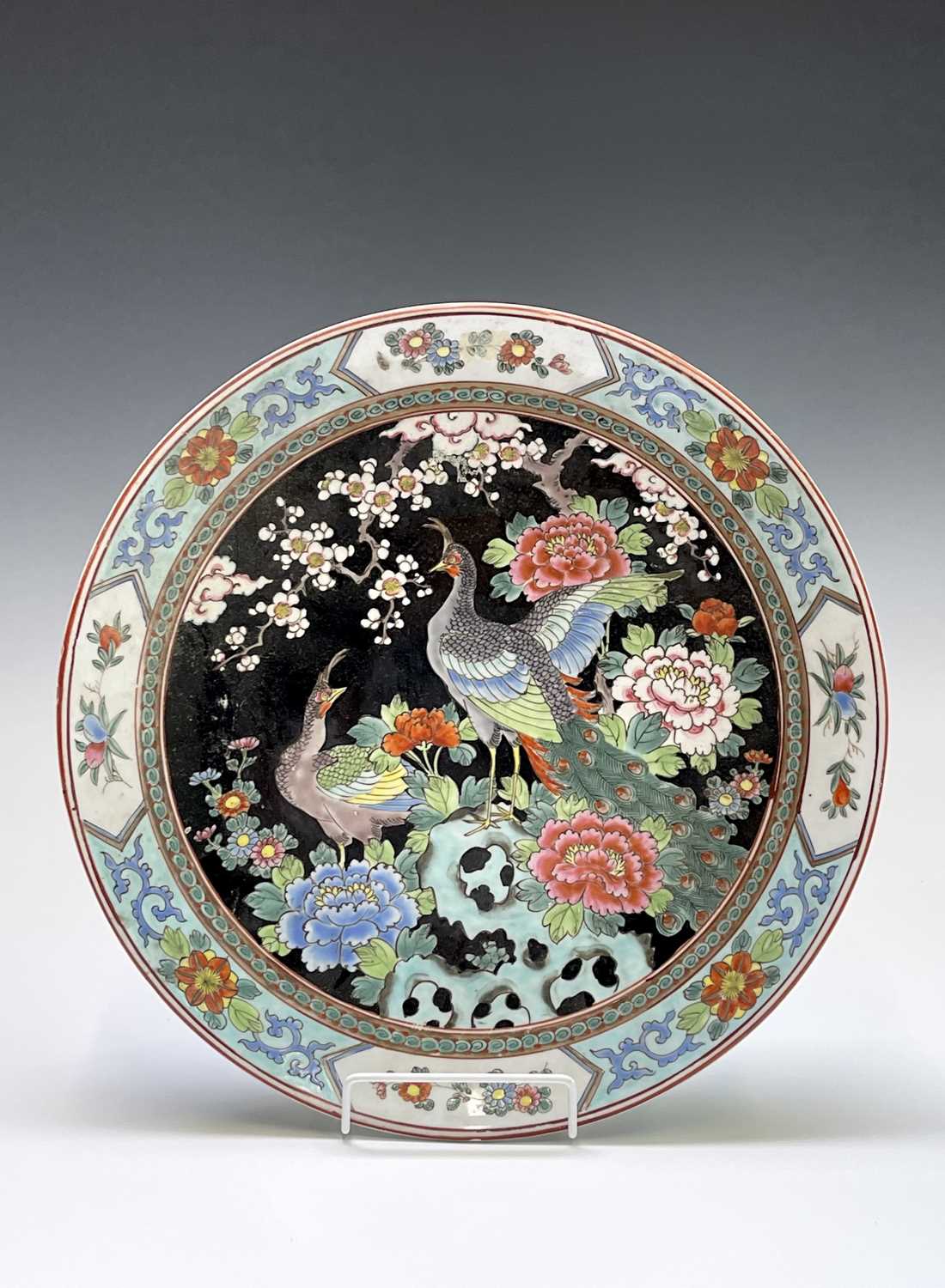 Lot 156 - A Chinese famille noire porcelain charger,...