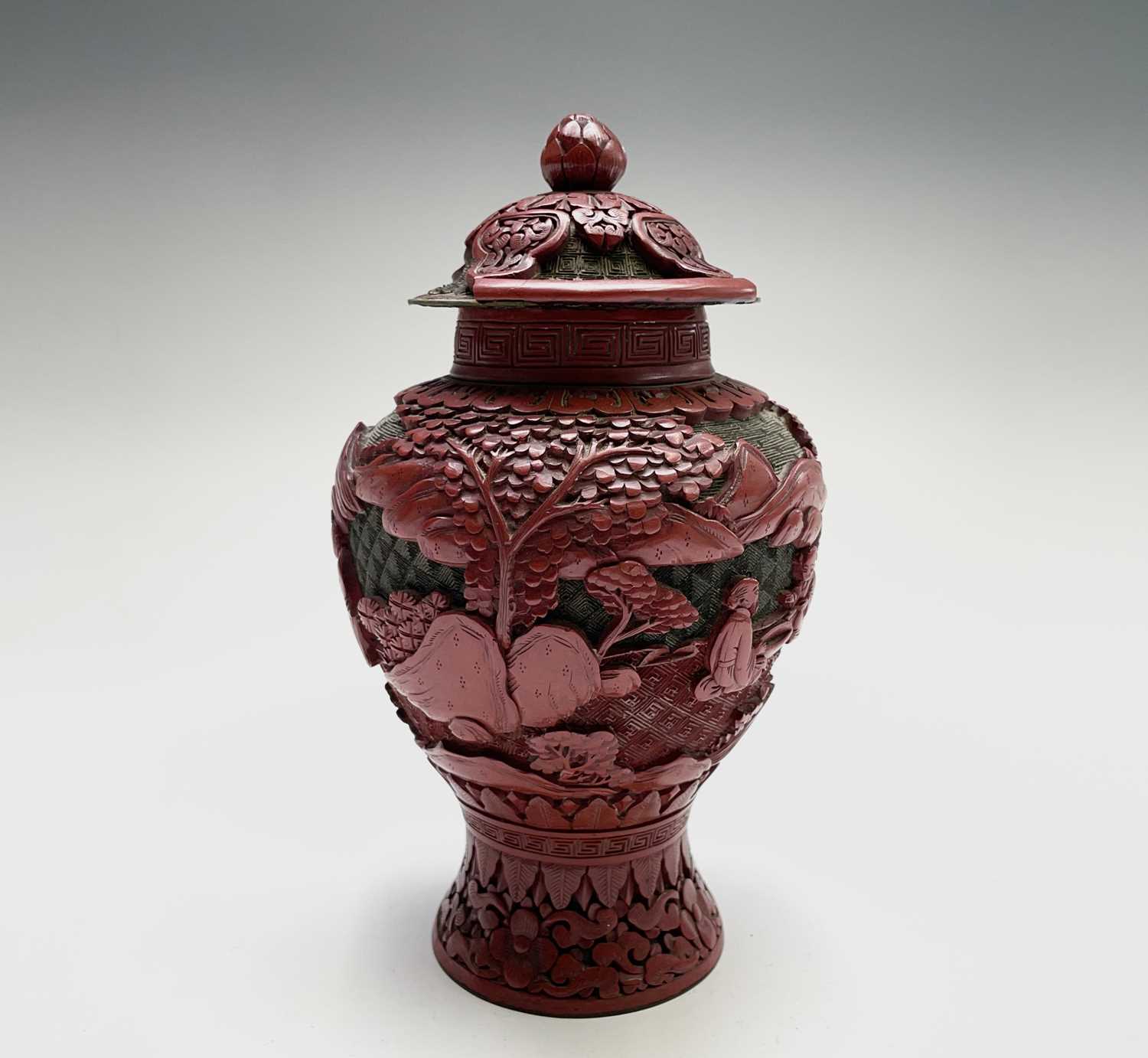 Lot 86 - A Chinese cinnabar lacquer vase and cover,...