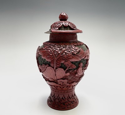 Lot 104 - A Chinese cinnabar lacquer vase and cover,...