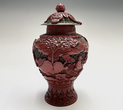 Lot 86 - A Chinese cinnabar lacquer vase and cover,...