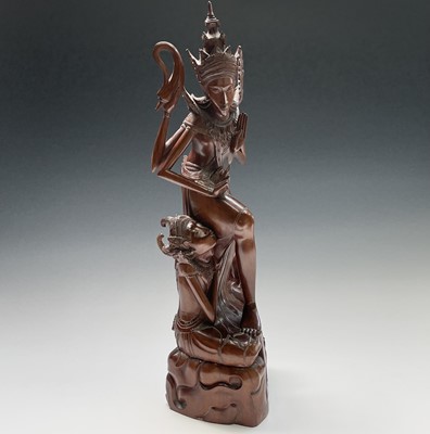 Lot 199 - A large Balinese carved wood figure of lady's,...