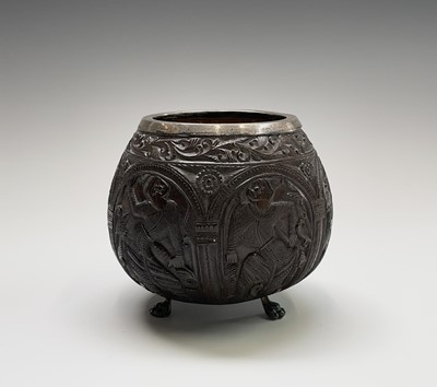 Lot 201 - A carved coconut cup, with silver rim,...