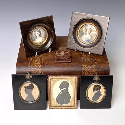 Lot 199 - A mid-19th century silhouette portrait of a...