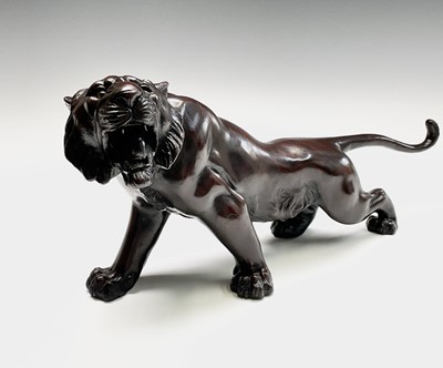 Lot 14 - A Japanese bronze model of a tiger, Meiji...