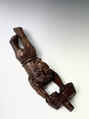 Lot 249 - A Chinese carved hardwood figure of man...