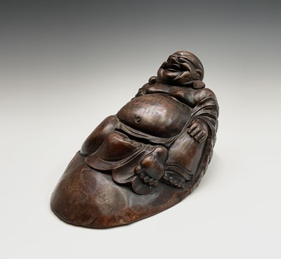 Lot 253 - A Chinese bamboo figure of a reclining buddha,...