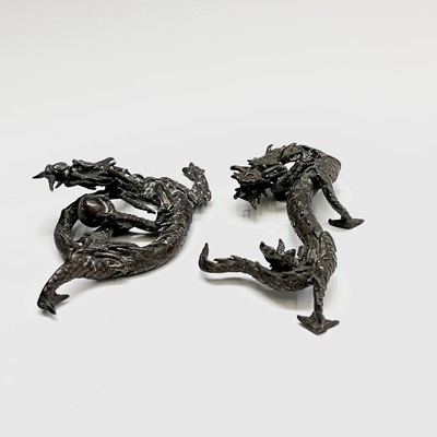 Lot 256 - A pair of Chinese bronze models of stylised...