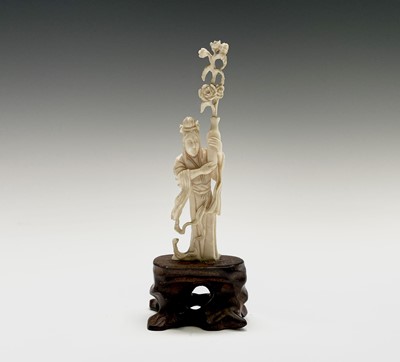 Lot 254 - A Chinese ivory figure of a female figure...