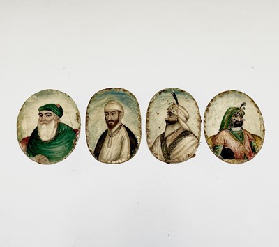 Lot 1042 - Four Persian unframed oval portrait miniature...