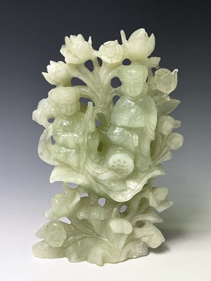 Lot 272 - A Chinese green stone group, carved with two...