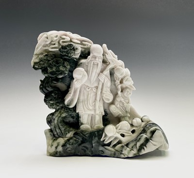 Lot 275 - A Chinese green hardstone carving of Shou Lao,...