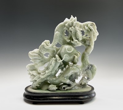 Lot 281 - A Chinese greenstone group, 20th century,...